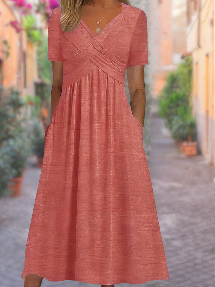 Elegante dameskleding: zomerjurk met V-hals, stijlvol en comfortabel. Geschikt voor feestjes of strand.