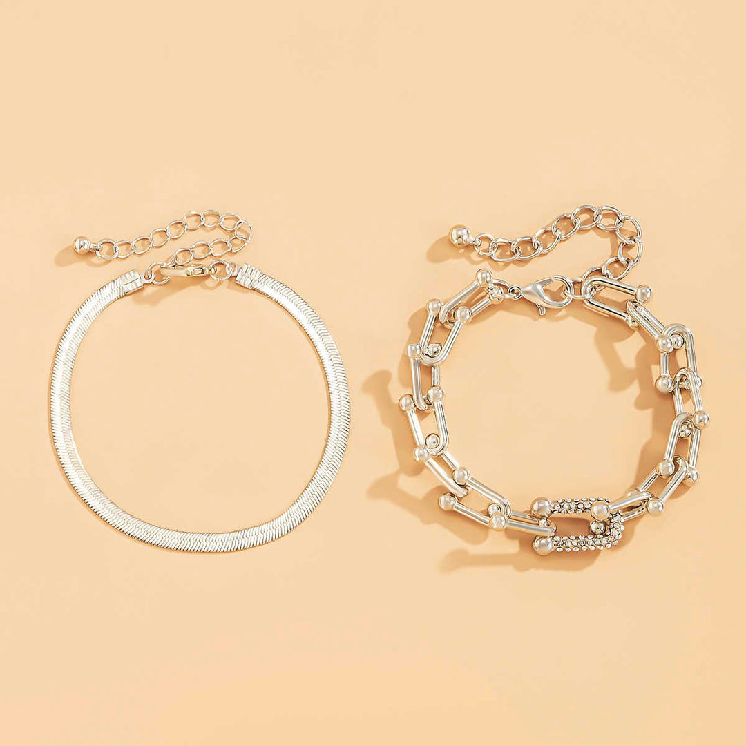 Goudkleurige schakelarmband in set met minimalistische armband, elegant sieraad voor dames.