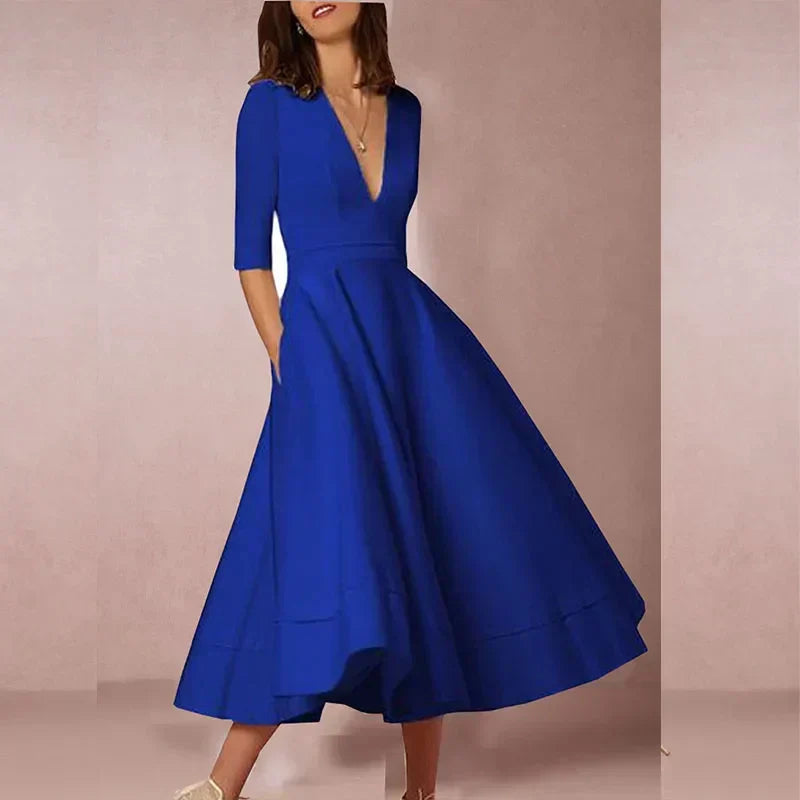 Dames A-lijn midi jurk, elegant model met V-hals en volumineuze rok. Comfortabele katoenmix, veelzijdig.