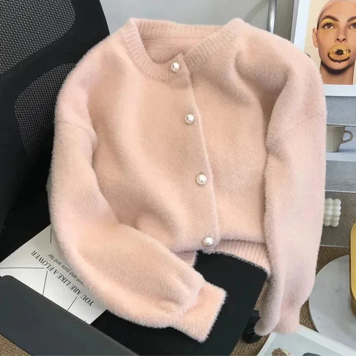 Zacht fluwelen damesvest voor optimaal comfort, compleet met stijlvolle parelknoppen en een warme pasvorm.
