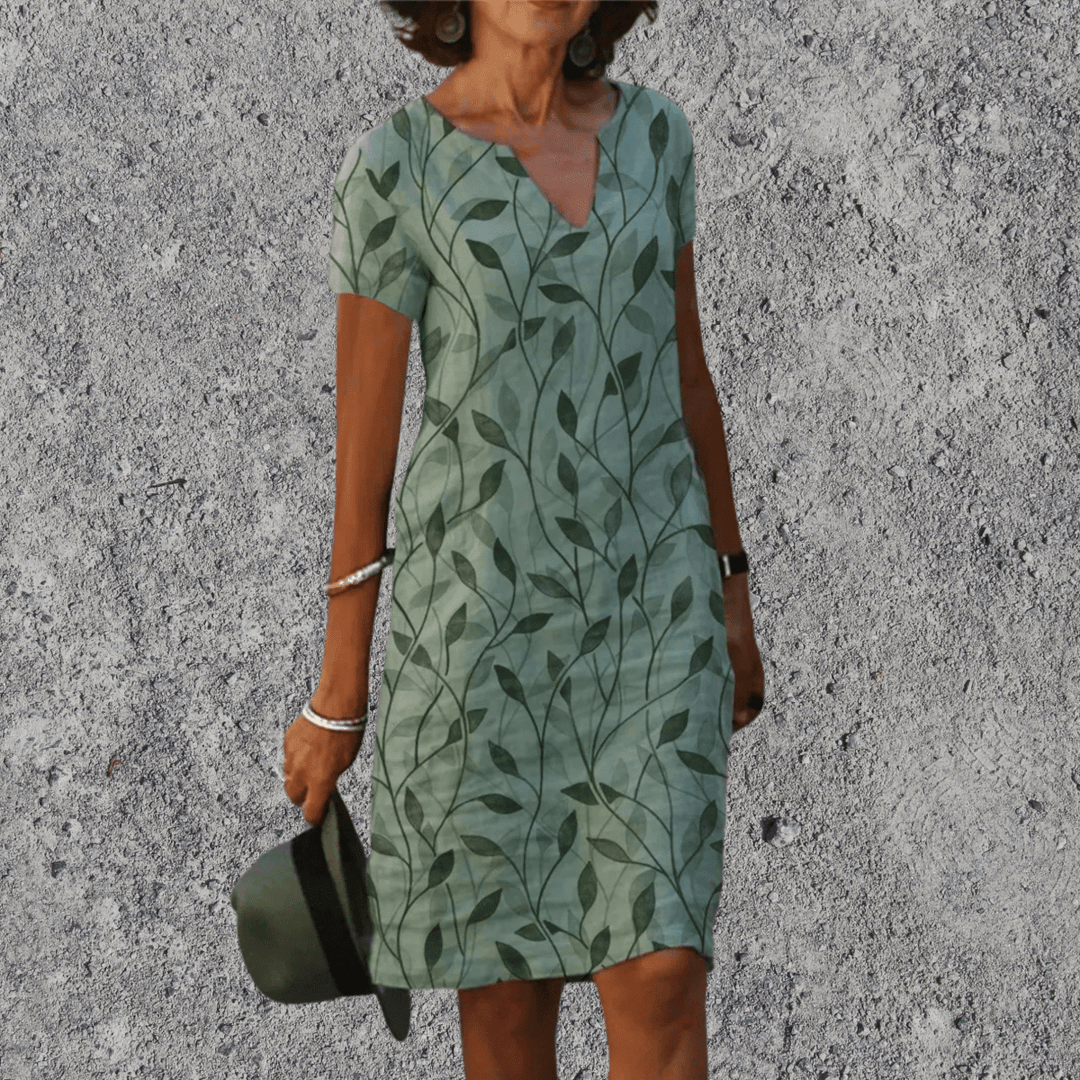 Comfortabele dames midi jurk met bloemenprint, v-hals en korte mouwen. Ideaal voor zomer.
