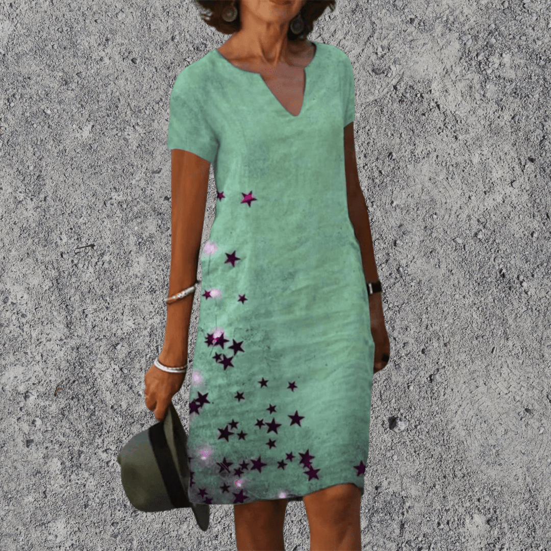 Midi zomerjurk voor dames, met levendige bloemenprint, v-hals en korte mouwen.