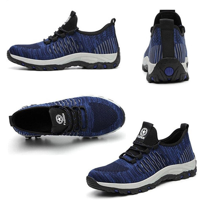 Veilige Indestructible werkschoenen voor heren, type sneaker, met slijtvaste buitenzool en stalen neus, geschikt voor industrieel gebruik.