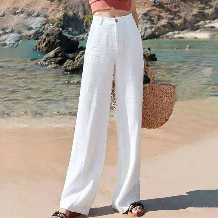 Beige dames pantalon Diana met wijde pijpen en hoge taille, elegant en comfortabel, perfect voor elke gelegenheid.