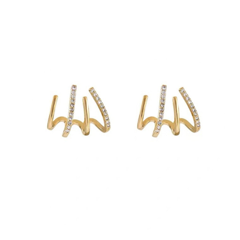 Dames klauw oorbellen van zirkonia, creëren de illusie van meerdere piercings. Elegant gouden of zilveren sieraad.