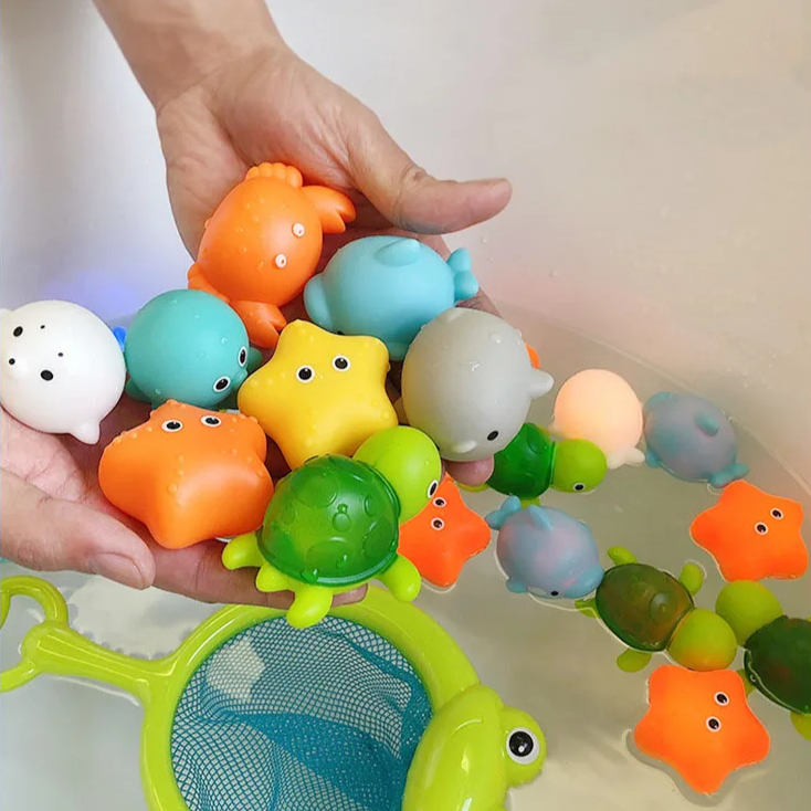 Kleurrijke licht badspeelgoed set; bevordert motoriek en visuele stimulatie bij jonge kinderen.