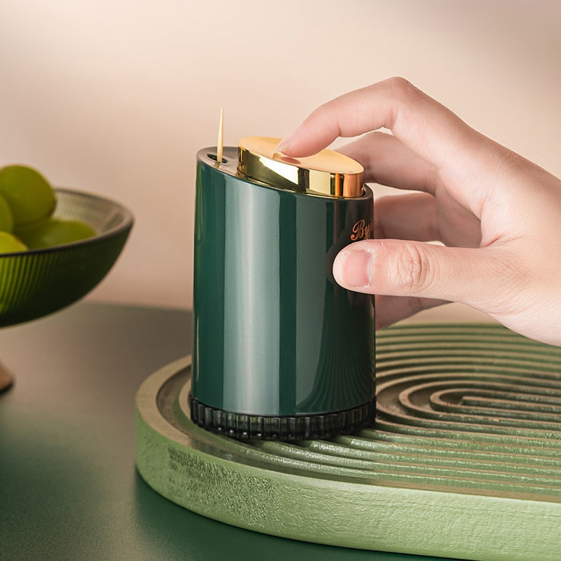 Compacte tandenstoker houder, perfect voor de eettafel of keukenblad. Elegant en hygiënisch met pop-up systeem.