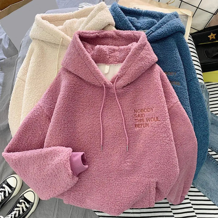 Dames winter hoodie roze, comfortabele loose fit warme trui. Ideaal voor koude dagen en dagelijks gebruik.