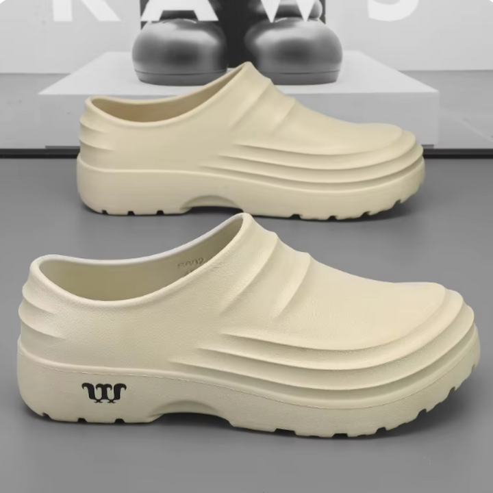 Ergonomische AquaStep clogs, waterdicht en lichtgewicht, ontworpen voor langdurig comfort en ondersteuning.