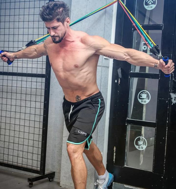 Draagbare MuscleBands weerstandsbanden set in opbergzak, ideaal voor thuis workouts en onderweg fitness.