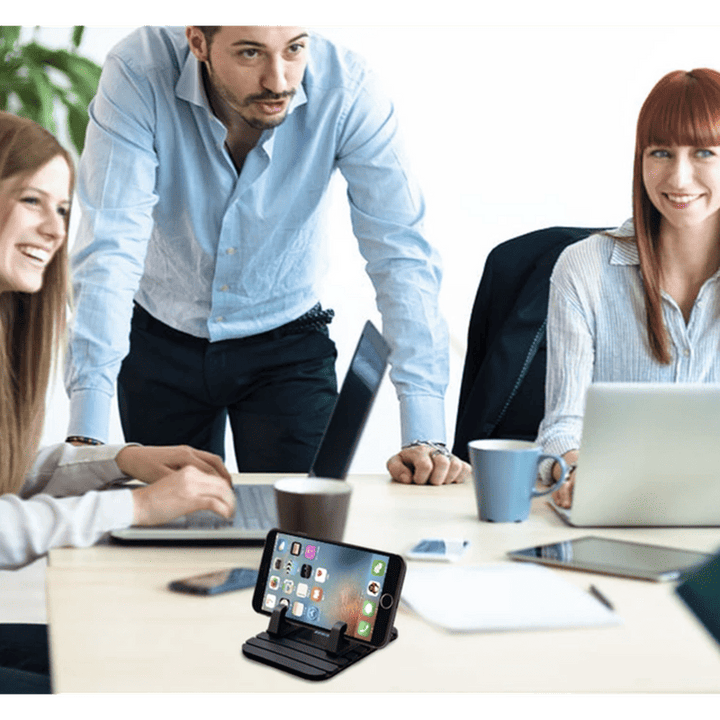 Flexibele siliconen antislip telefoonhouder; universeel bruikbaar voor auto, bureau, handsfree smartphone.