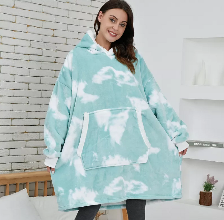Comfortabele dekenjas met capuchon, ideaal als huispak of loungewear voor dames en heren.