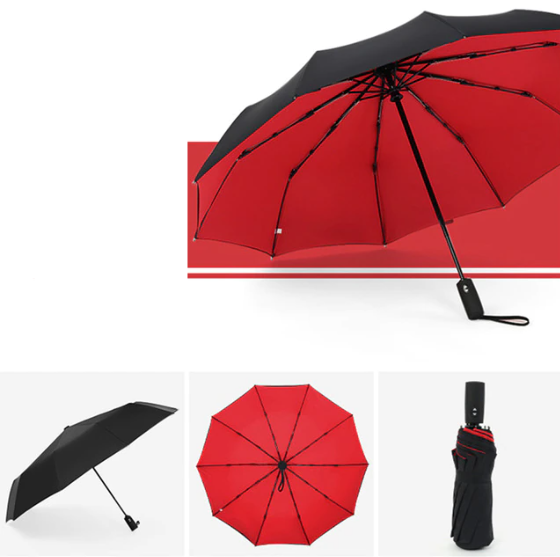 Compacte stormparaplu in een hand, toont het lichte en handzame ontwerp voor onderweg.