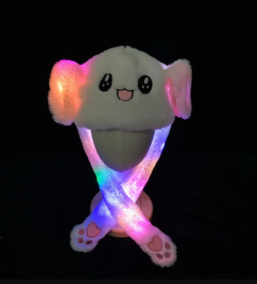 Interactieve pluche muts: kinder konijnenmuts met knijpbare pompen voor bewegende oren en LED licht effecten.