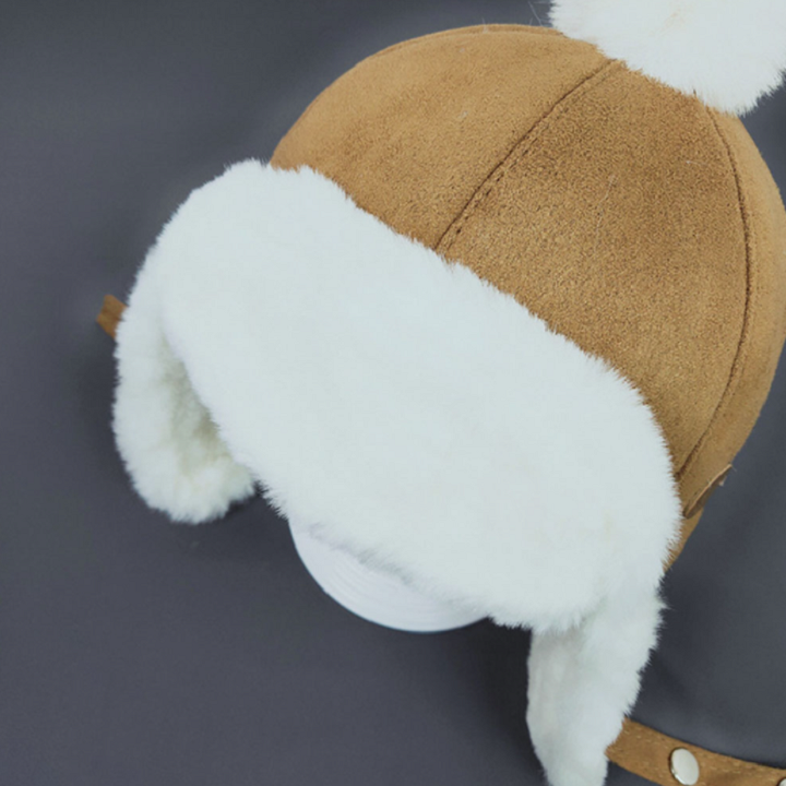 Warme wintermuts voor baby's, beschermt hoofd en oren tegen kou tijdens buitenactiviteiten.