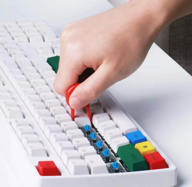 Compacte 5-in-1 toetsenbord schoonmaakborstelset, een handige gadget en kantooraccessoire voor PC en laptop onderhoud.