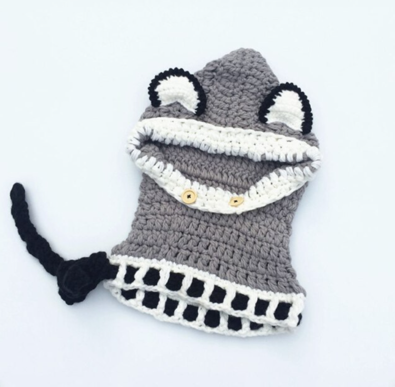 Oranje wollen wintermuts voor baby's. Zorgt voor warmte en comfort tijdens koude dagen.