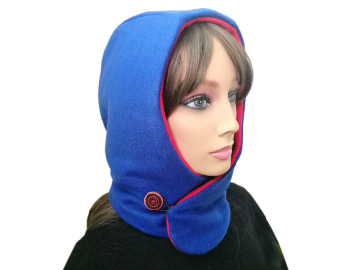 Warme unisex sjaal met capuchon; functioneert als muts & nekwarmer. Modieus winter accessoire voor fietsen/skiën.