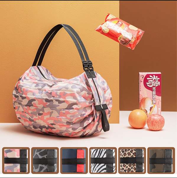 Ruime dames opvouwbare tas, gevuld met boodschappen, ideaal voor winkelen en reizen; sterk nylon.
