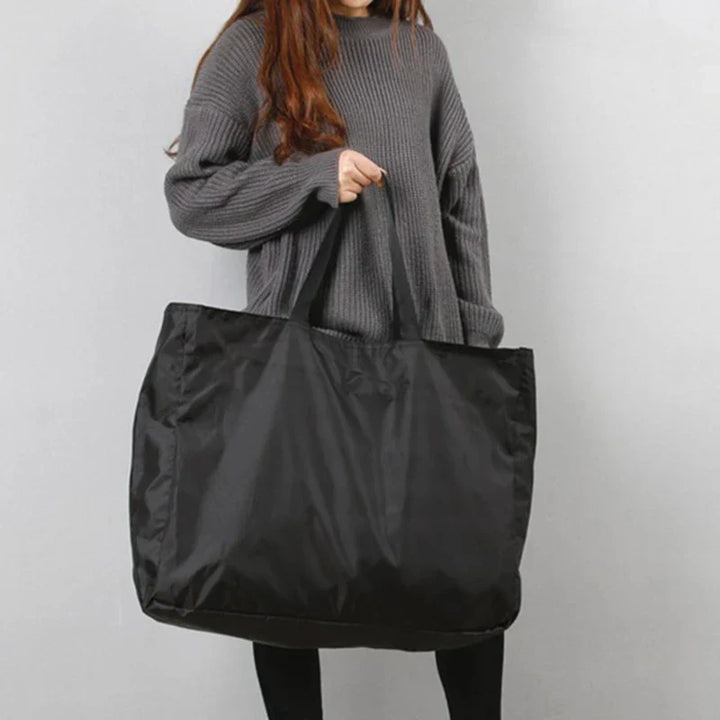 Duurzame nylon waterdichte weekendtas voor dames, opvouwbaar en ruim, perfecte sport- of reistas.