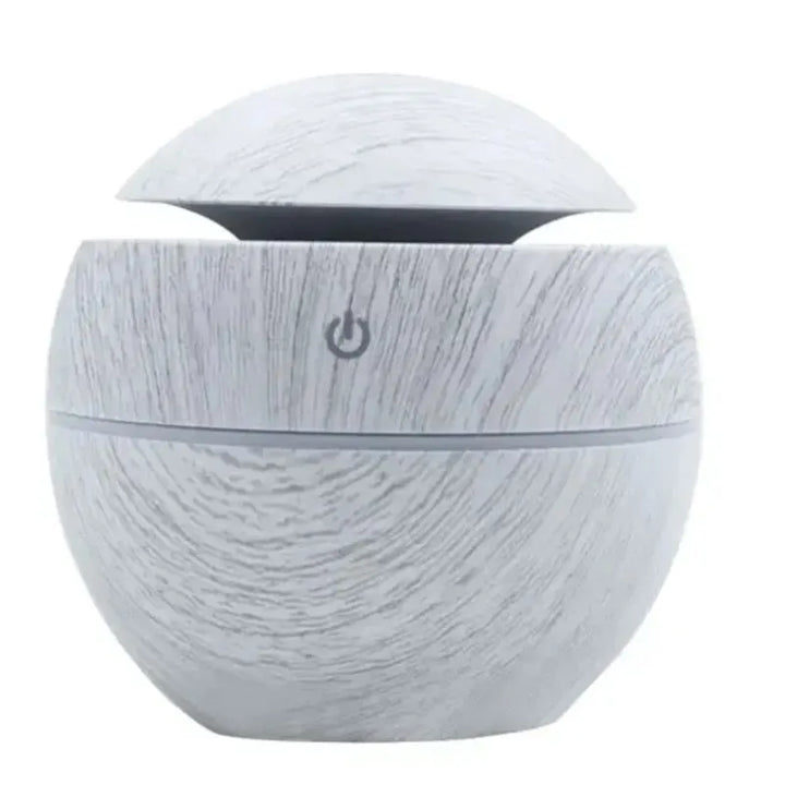 Draagbare fluisterstille luchtbevochtiger met diffuser, 130ml, USB-voeding en geïntegreerd LED-nachtlampje.
