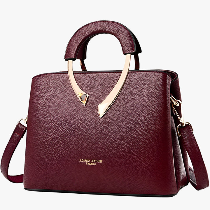 Close-up van luxe leren tote tas, fijne textuur en afwerking, premium kwaliteit voor dames.