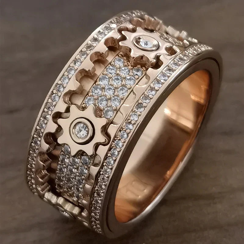 Rustgevende Spinfinity draairing, een spinningsring in zilver en roségoud die helpt tegen stress en voor focus.