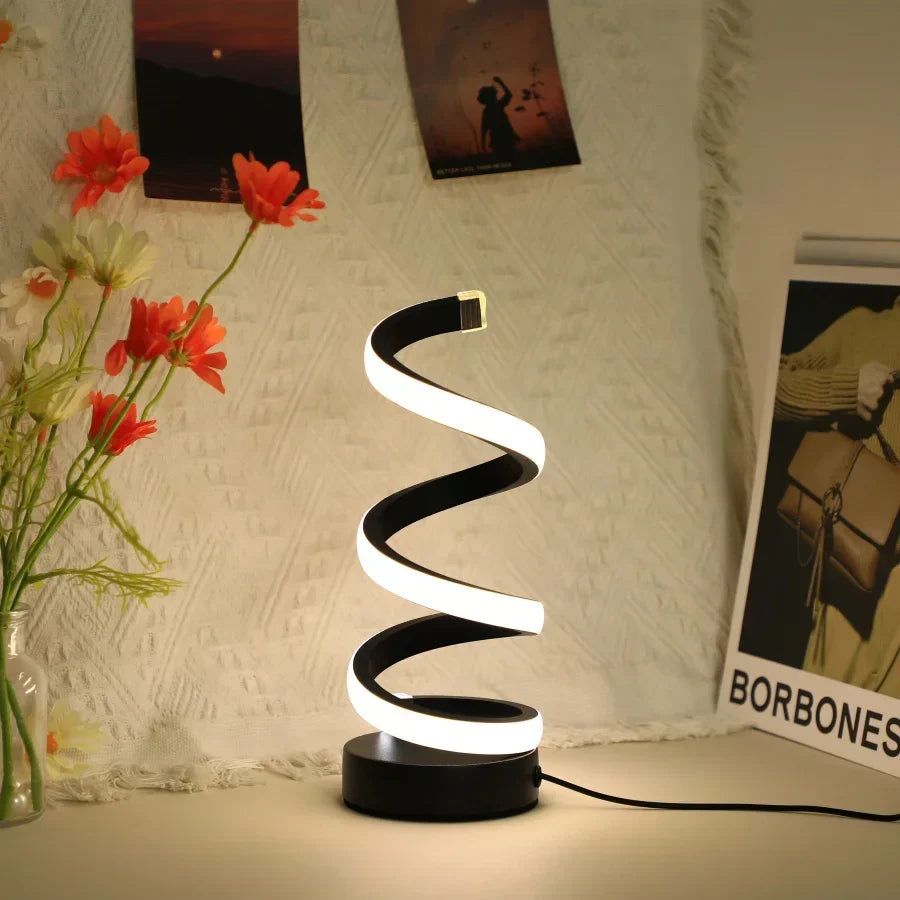 Elegante S-vormige leeslamp in zwart, een design tafellamp die past bij moderne interieurstijlen.