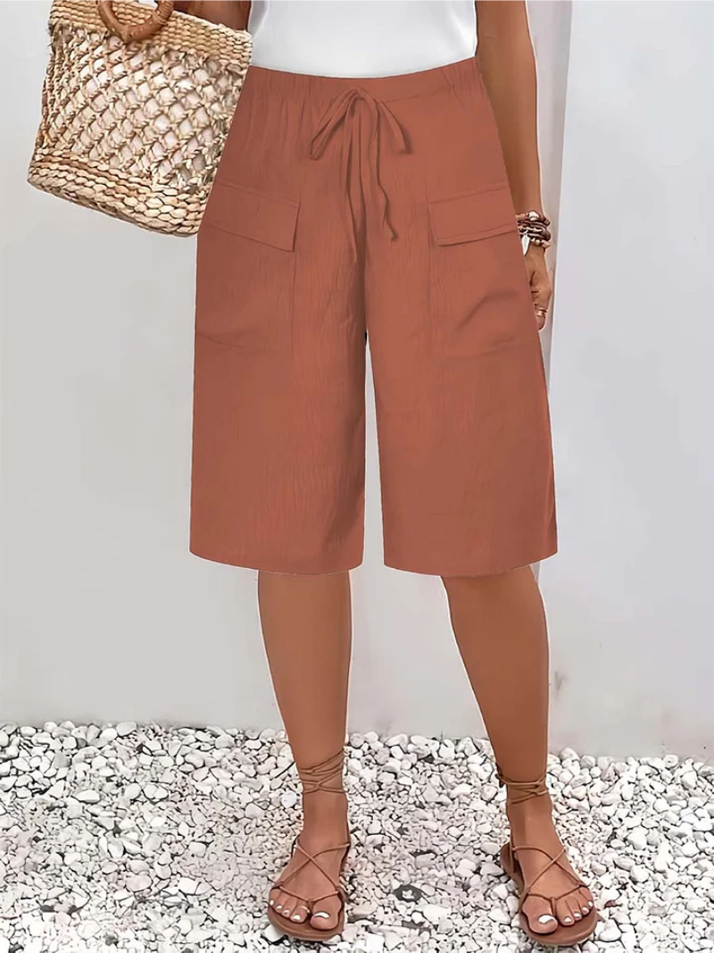 Oranje dames shorts met ontspannen pasvorm, ultiem comfort voor een stijlvolle zomerlook. Ook in grijs.