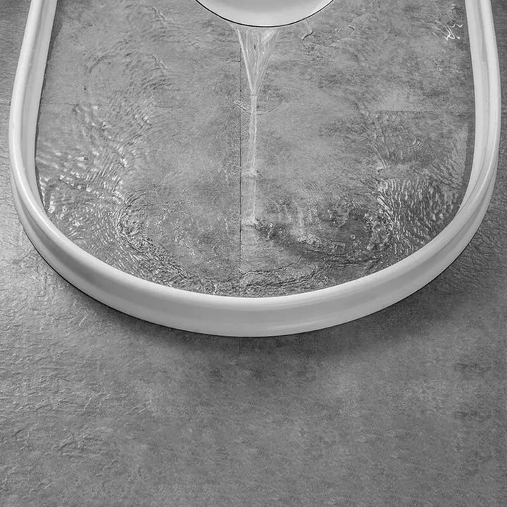 Akua WaterStopper: innovatieve douchebarrière oplossing om uw badkamer vloer te beschermen tegen water en natte ruimtes.