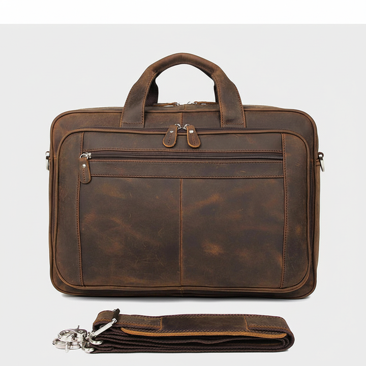 Stijlvolle bruine heren aktetas/laptoptas met schouderband, perfect voor werk, reizen en kantoorbenodigdheden.
