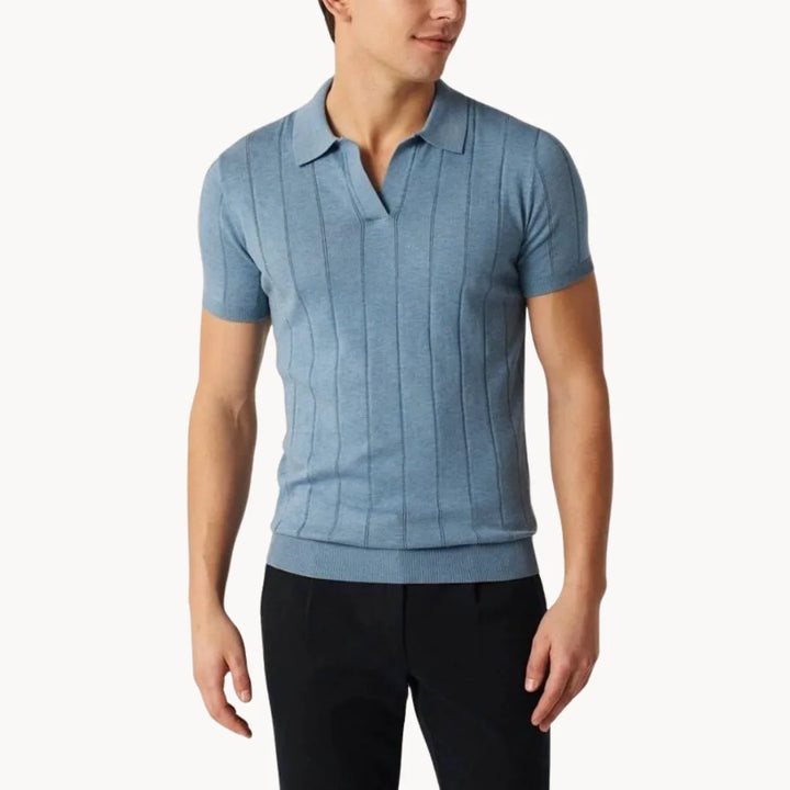 Marineblauwe heren polo, slim fit met korte mouwen en ribbels, comfortabel en verfijnd.