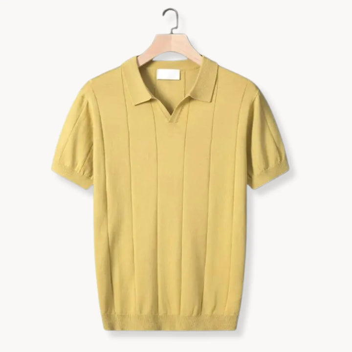 Slim fit gebreide heren polo, korte mouwen en karakteristieke ribbels, voor de modebewuste man.