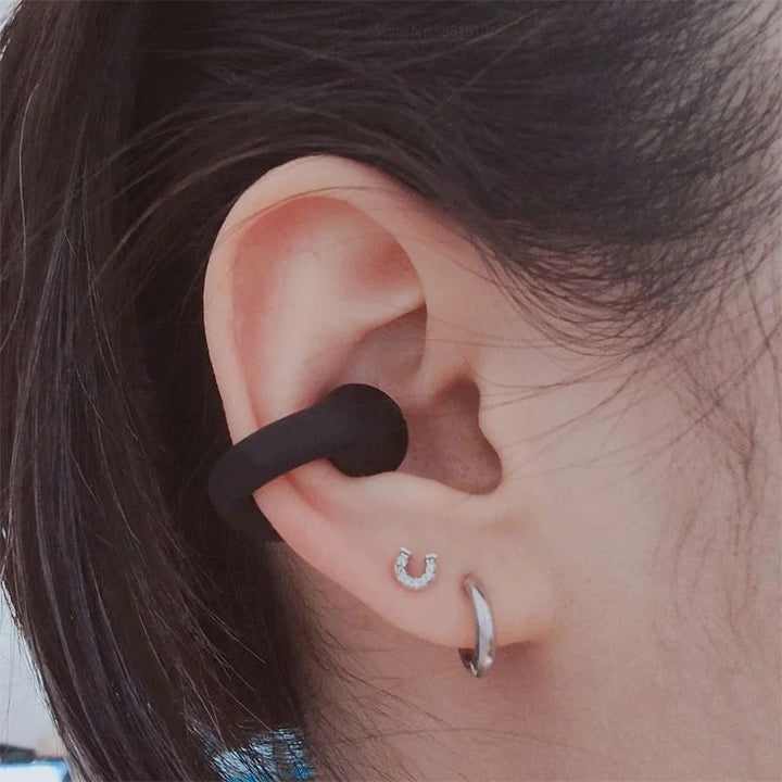 Unisex draadloze botgeleiding oordopjes voor open-ear luisteren. Perfect voor sport en muziek.