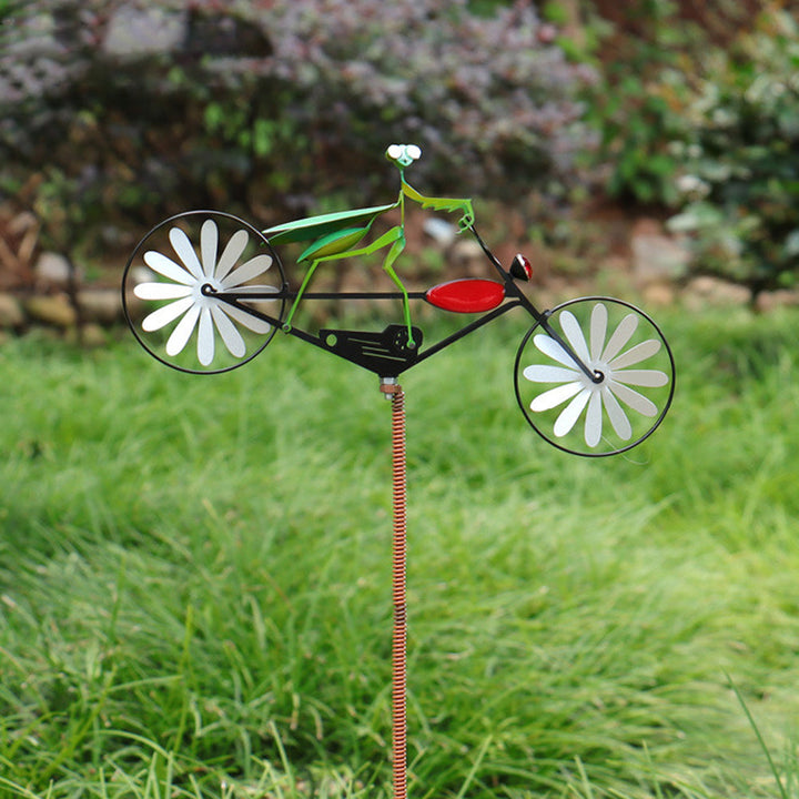 Vrolijke tuindecoratie windmolen: fietsend dier brengt plezier en kleur in elke tuin, een uniek tuinornament.