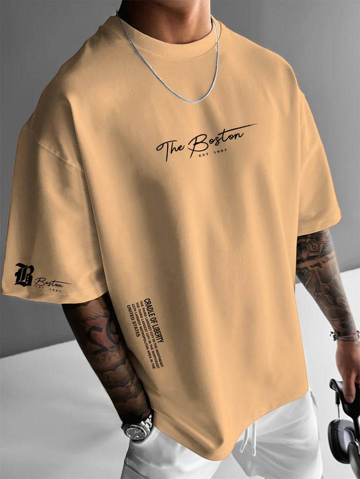 Trendy heren T-shirt, loose fit pasvorm met opvallende slogan print, perfect voor een relaxte stijl.