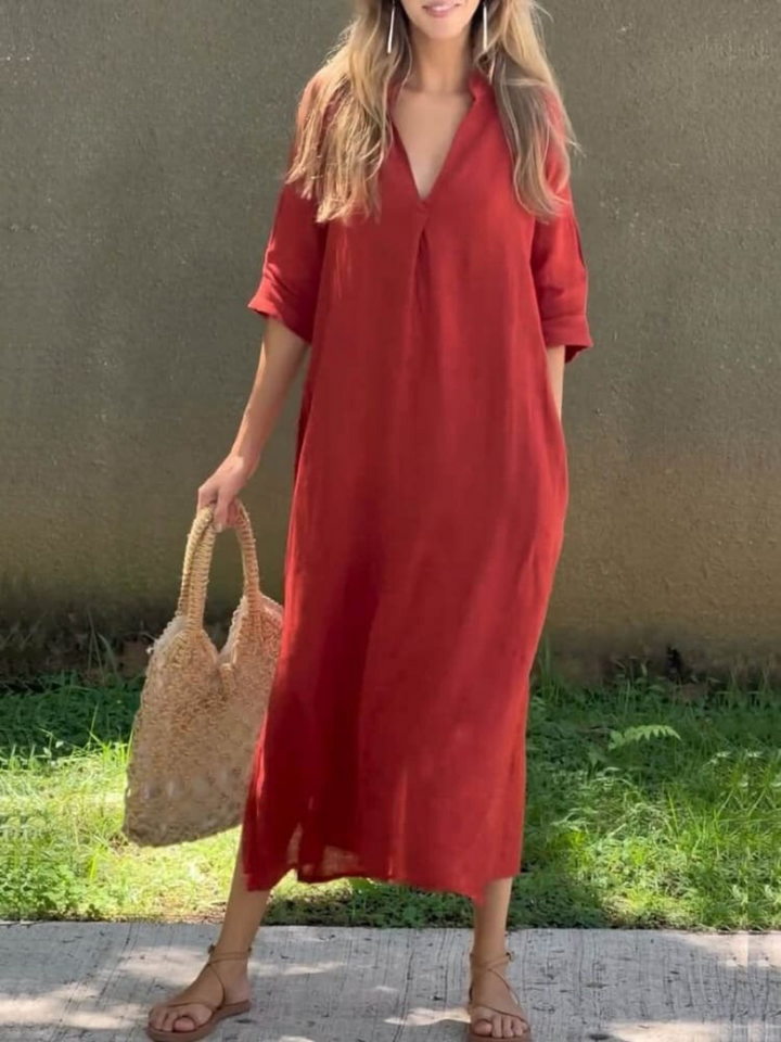 Elegante soepelvallende dames midi jurk met comfortabele 3/4 mouwen. Veelzijdig voor elke gelegenheid.