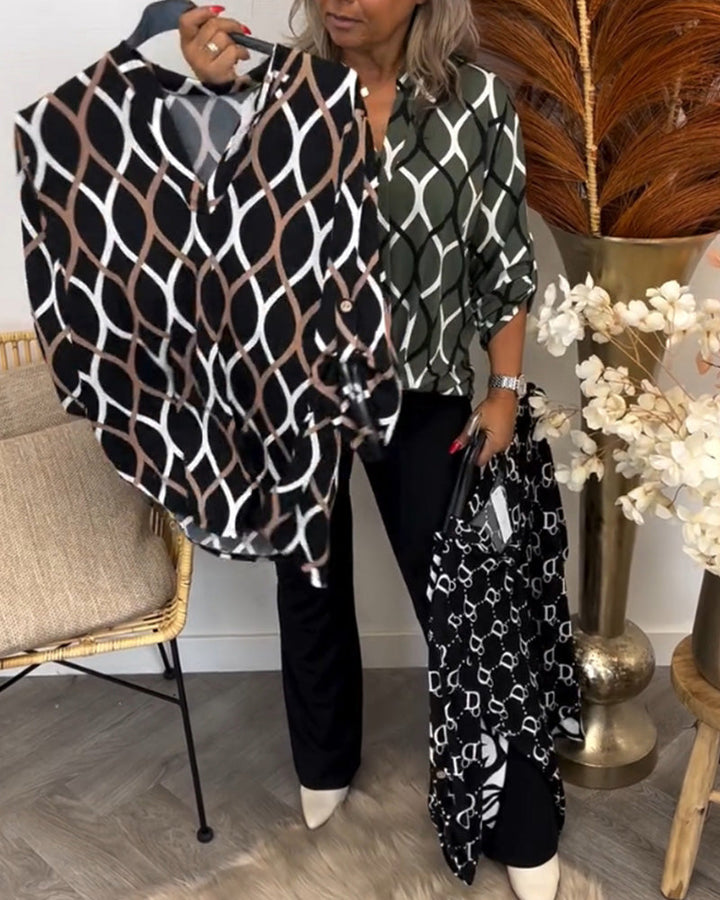 Gevouwen dames blouse met grafische print, v-hals en driekwart mouw. Een veelzijdig item met loose fit.