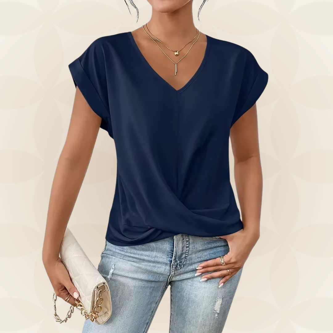 Modieuze dames top met V-hals en gedrapeerd detail. Perfecte casual of chique zomer top.