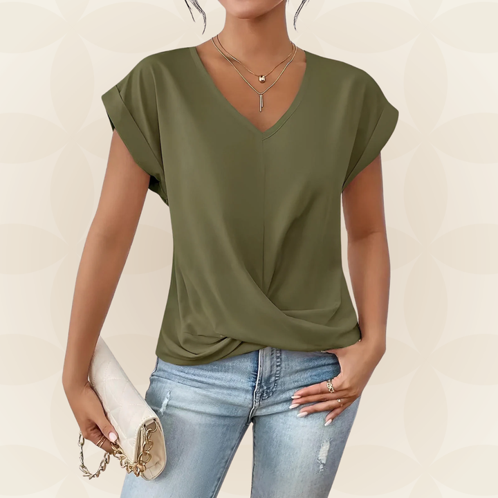 Veelzijdige dames V-hals top met gedrapeerd detail. Stijlvolle losvallende top, ideaal voor zomer en lente.