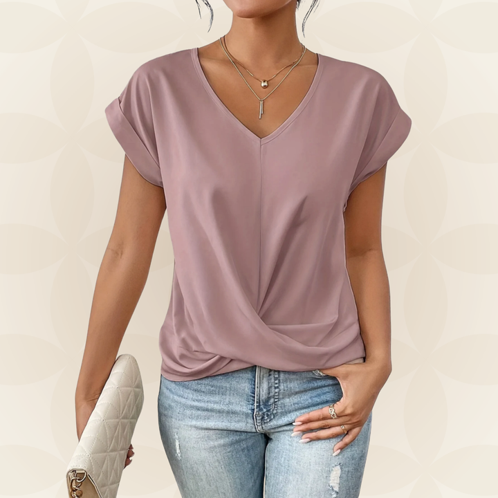 Stijlvolle dames top met V-hals en elegant gedrapeerd detail. Veelzijdige en comfortabele pasvorm.