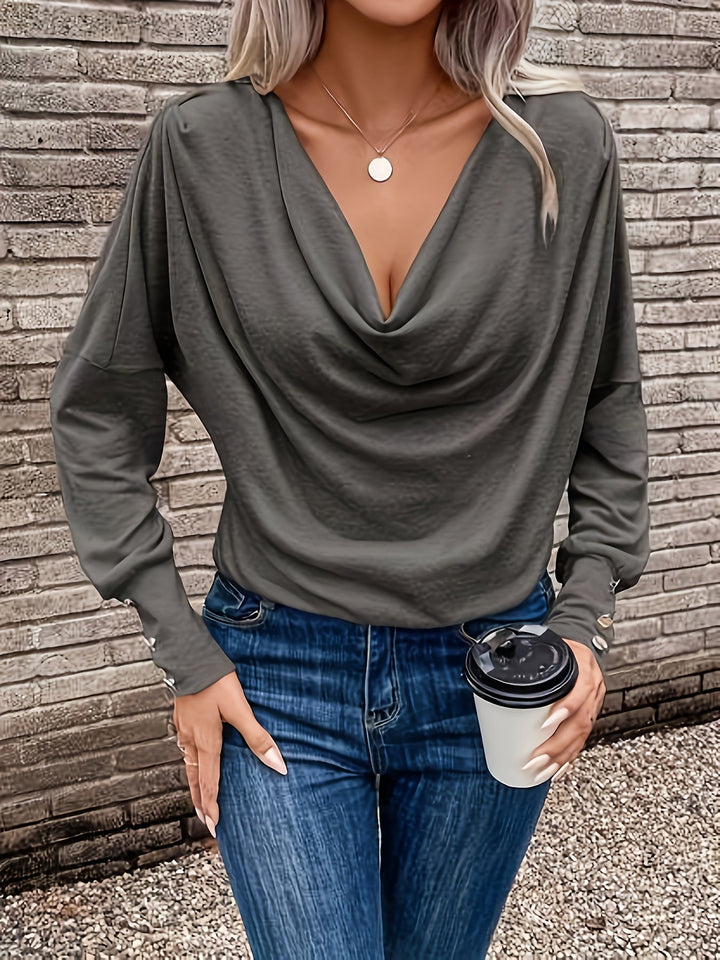 Veelzijdige damestop, trui met vallende kraag; combineerbaar voor zowel casual als geklede look.
