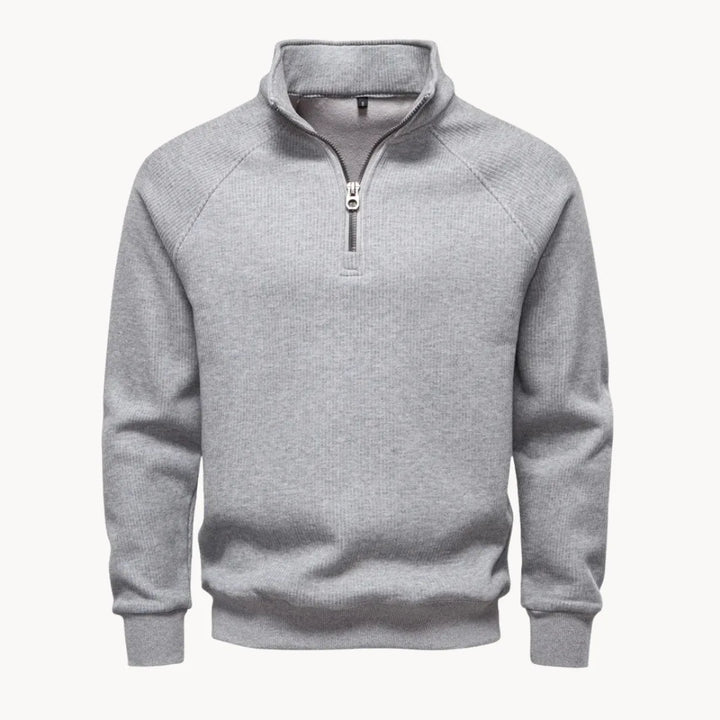Elegante zwarte heren trui met kwart rits en opstaande kraag, combineert comfort en klasse.