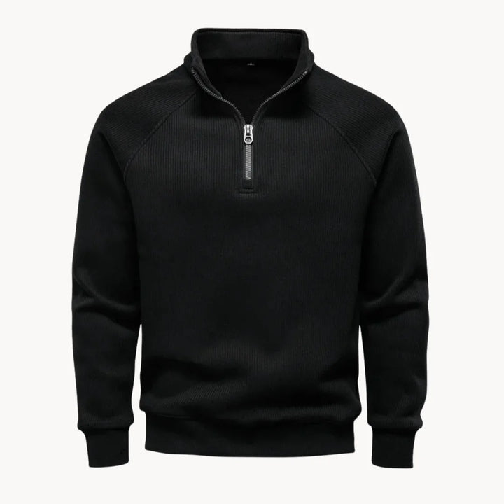 Comfortabele, regular fit heren trui met opstaande kraag en kwart rits in diep zwart.