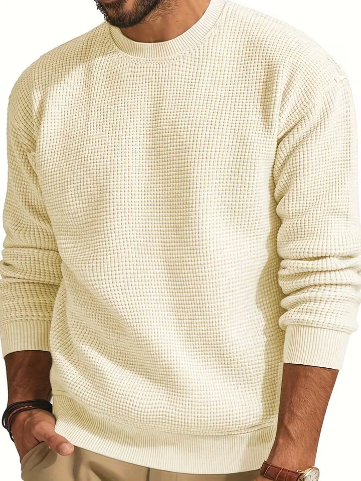 Zachte herentrui met ronde hals, gebreid in een effen kleur. Comfort en warmte gecombineerd.