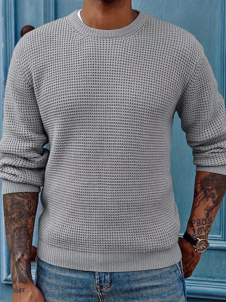 Effen gebreide herentrui met ronde hals. Een klassieke sweater voor comfort en casual look.
