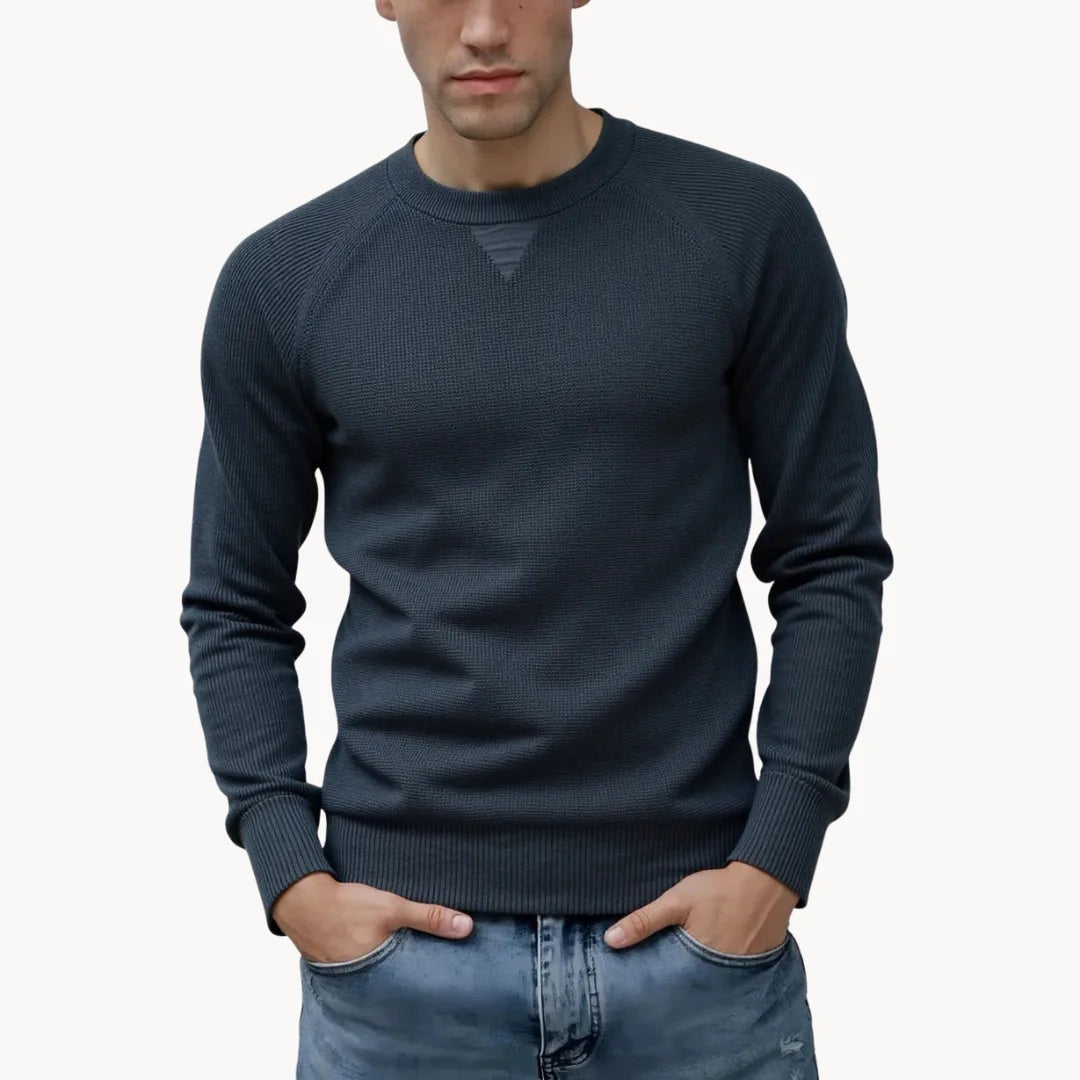 Comfortabele grijze heren trui met ronde hals en raglanmouwen, perfect voor dagelijks comfort.