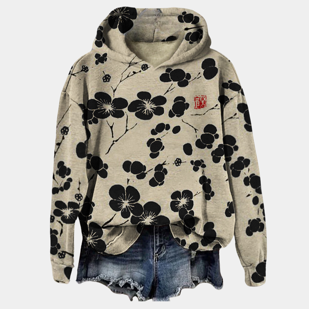 Comfortabele dames hoodie met kleurrijke bloemenprint, perfect voor een trendy casual look.