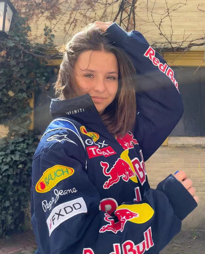 Oversized donkerblauwe racingjas voor heren en dames, perfect voor streetwear en casual mode.