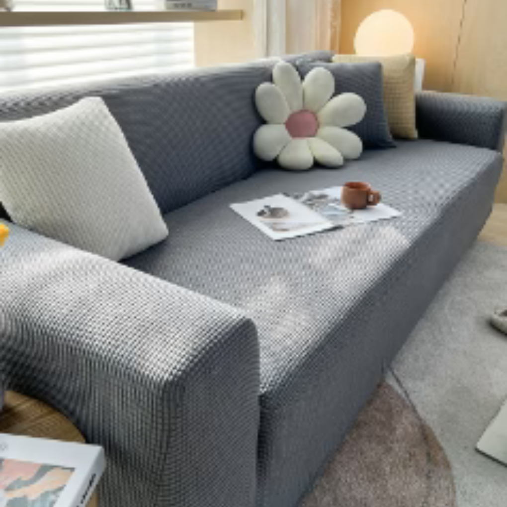 Flexibele StretchGuard stretchhoes: Zachte, wasbare meubelbescherming, vernieuwt uw bank en interieur.